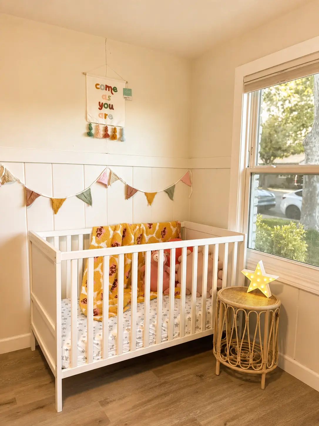 Cozy child rest area beside a bright window and soft decorations